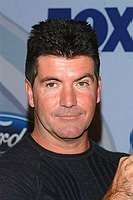 Photo of Simon Cowell at party to celebrate the American Idol Top 12 Finalists at Pearl in Hollywood.