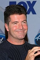 Photo of Simon Cowell at party to celebrate the American Idol Top 12 Finalists at Pearl in Hollywood.