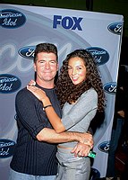 Photo of Simon Cowell (American Idol judge) and Terri Seymour at party to celebrate the American Idol Top 12 Finalists at Pearl in Hollywood.