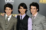 Photo of Jonas Brothers - Nick Jonas, Joe Jonas and Kevin Jonas  at the 2008 American Music Awards at the Nokia Theatre, Los Angeles on 23rd November 2008.