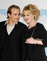 Photo of Jesse Johnson and Melanie Griffith at the 37th AFI Life Achievement Awards Honoring Michael Douglas at Sony Studios, Culver City on June 11th 2009. 
