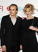 Photo of Jesse Johnson and Melanie Griffith at the 37th AFI Life Achievement Awards Honoring Michael Douglas at Sony Studios, Culver City on June 11th 2009. 