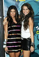 Photo of Fergie and Miley Cyrus at the Teen Choice 2009 Awards at Gibson Amphitheatre in Universal City, August 9th 2009.<br>Photo by Chris Walter/Photofeatures