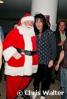 Alice Cooper and Santa Claus at Alice Cooper's Christmas Pudding show for his Solid Rock Foundation Charity at Dodge Theatre in Phoenix, Arizona, December 18th 2004. Photo by Chris Walter/Photofeatures.