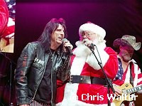 Alice Cooper, Ted Nugent and Santa at Alice Cooper's Christmas Pudding show for his Solid Rock Foundation Charity at Dodge Theatre in Phoenix, Arizona, December 18th 2004. Photo by Chris Walter/Photofeatures.