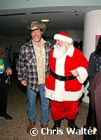 Ted Nugent and Santa Claus at Alice Cooper's Christmas Pudding show for his Solid Rock Foundation Charity at Dodge Theatre in Phoenix, Arizona, December 18th 2004. Photo by Chris Walter/Photofeatures.