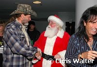 Ted Nugent and Santa Claus at Alice Cooper's Christmas Pudding show for his Solid Rock Foundation Charity at Dodge Theatre in Phoenix, Arizona, December 18th 2004. Photo by Chris Walter/Photofeatures.