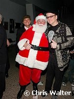 Ronin Zander and Rick Nielsen of Cheap Trick with Santa Claus at Alice Cooper's Christmas Pudding show for his Solid Rock Foundation Charity at Dodge Theatre in Phoenix, Arizona, December 18th 2004. Photo by Chris Walter/Photofeatures.
