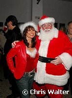 Jessi Colter and Santa Claus at Alice Cooper's Christmas Pudding show for his Solid Rock Foundation Charity at Dodge Theatre in Phoenix, Arizona, December 18th 2004. Photo by Chris Walter/Photofeatures.