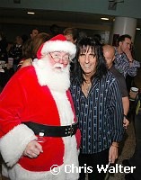 Alice Cooper and Santa Claus at Alice Cooper's Christmas Pudding show for his Solid Rock Foundation Charity at Dodge Theatre in Phoenix, Arizona, December 18th 2004. Photo by Chris Walter/Photofeatures.