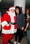 Alice Cooper and Santa Claus at Alice Cooper's Christmas Pudding show for his Solid Rock Foundation Charity at Dodge Theatre in Phoenix, Arizona, December 18th 2004. Photo by Chris Walter/Photofeatures.
