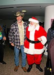 Ted Nugent and Santa Claus at Alice Cooper's Christmas Pudding show for his Solid Rock Foundation Charity at Dodge Theatre in Phoenix, Arizona, December 18th 2004. Photo by Chris Walter/Photofeatures.