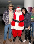 Ted Nugent, Santa Claus and Alice Cooper at Alice Cooper's Christmas Pudding show for his Solid Rock Foundation Charity at Dodge Theatre in Phoenix, Arizona, December 18th 2004. Photo by Chris Walter/Photofeatures.