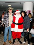 Ted Nugent, Santa Claus and Alice Cooper at Alice Cooper's Christmas Pudding show for his Solid Rock Foundation Charity at Dodge Theatre in Phoenix, Arizona, December 18th 2004. Photo by Chris Walter/Photofeatures.