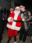 Ronin Zander and Rick Nielsen of Cheap Trick with Santa Claus at Alice Cooper's Christmas Pudding show for his Solid Rock Foundation Charity at Dodge Theatre in Phoenix, Arizona, December 18th 2004. Photo by Chris Walter/Photofeatures.