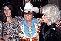 Photo of Emmylou Harris, Nudie Cohn and Dolly Parton 1978<br> Chris Walter<br>
