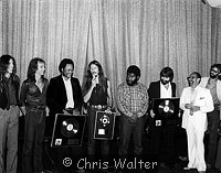 Photo of Doobie Brothers 1979 Presented with Gold and Platinum discs for 'Minute By Minute"