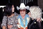 Photo of Emmylou Harris, Nudie Cohn and Dolly Parton<br> Chris Walter<br>