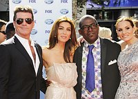 Photo of Simon Cowell, Mezhgan Hussainy, Randy Jackson and Kara DioGuardi at the 2010 American Idol Finale at Nokia Theatre in Los Angeles, May 26th 2010.<br>Photo by Chris Walter/Photofeatures