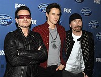 Photo of Bono and the Edge of U2 with Reeve Carney from Spider-Man at the 2011 American Idol Finale at Nokia Theatre in Los Angeles, May 25th 2011.<br>Photo by Chris Walter/Photofeatures