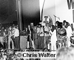 Photo of John Lennon 1969 with George Harrison, Eric Clapton, Delaney Bramlett, Nonnie Bramlett, Yoko Ono and John Lennon at the Lyceum, December 15th 1969.<br> Chris Walter<br>