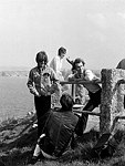 Photo of The Beatles 1967 George Harrison and John Lennon with Neil Aspinall film Magical Mystery Tour at Newquay <br>© Chris Walter<br>