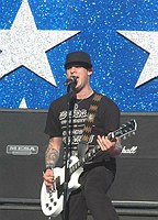 Photo of Good Charlotte's Joel Madden performs at the NFL Opening Kickoff 2005 at the Los Angeles Coliseum