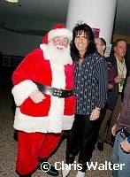 Alice Cooper and Santa Caus at Alice Cooper's Christmas Pudding show for his Solid Rock Foundation Charity at Dodge Theatre in Phoenix, Arizona, December 18th 2004. Photo by Chris Walter/Photofeatures.