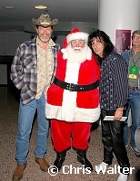 Ted Nugent, Santa Claus and Alice Cooper at Alice Cooper's Christmas Pudding show for his Solid Rock Foundation Charity at Dodge Theatre in Phoenix, Arizona, December 18th 2004. Photo by Chris Walter/Photofeatures.