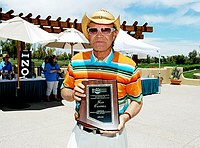Photo of Glen Campbell with presentation for his induction in Arizona Music and Entertainment Hall Of Fame at the 9th Alice Cooper Golf Tournament in Scottsdale to benefit his Solid Rock Foundation Charity, May 2nd 2005. phoo by Chris walter/Photofeatures.