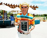 Photo of Glen Campbell with presentation for his induction in Arizona Music nd Entertainment Hall Of Fame at the 9th Alice Cooper Golf Tournament in Scottsdale to benefit his Solid Rock Foundation Charity, May 2nd 2005. phoo by Chris walter/Photofeatures.