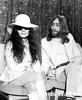 Beatles 1969 John Lennon and Yoko Ono at Heathrow Airport.