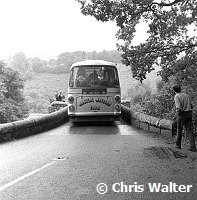 Beatles 1967 at start of Magical Mystery Tour, the bus gets stuck on a bridge.