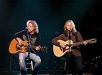 Photo of Jack Blades and Tommy Shaw - Shaw Blades<br>at Don Felder and friends Rock Cerritos for Katrina<br>at Cerritos Center For The Performing Arts, February 1st 2006.<br>Photo by Chris Walter/Photofeatures