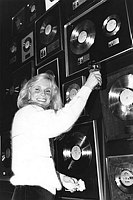 Photo of Kim Carnes 1981 toast International Gold and Platinum discs for Bette Davis Eyes.<br> Chris Walter<br>
