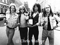 Slade 1973 Jim Lea, Noddy Holder, Don Powell and Dave Hill celebrate a #1 single (Skweeze Me)<br> Chris Walter<br>